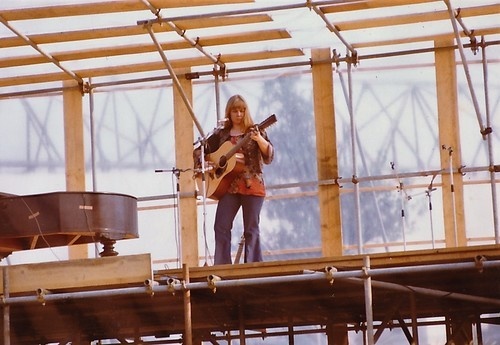 Sandy Denny performing with an acoustic guitar; the supplied source labels the photograph 1970s and gives no exact date or location